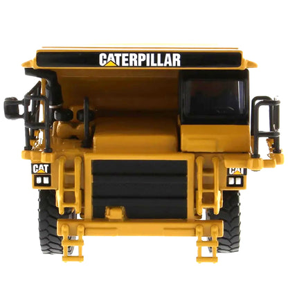 Model of a Caterpillar 775E Off-Highway Dump Truck on a White Background