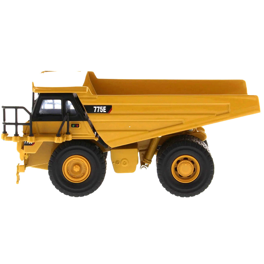 Model of a Caterpillar 775E Off-Highway Dump Truck on a White Background