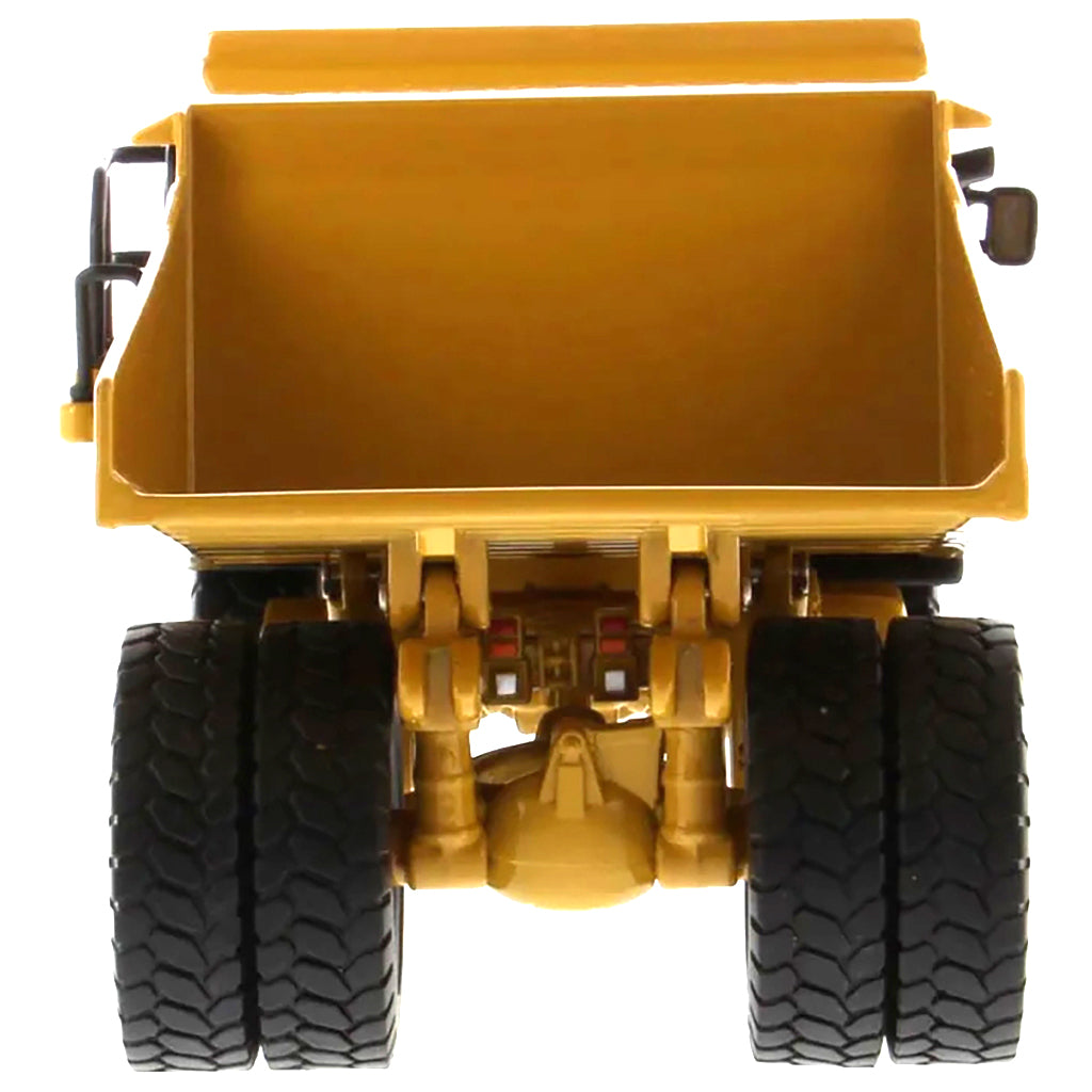 Model of a Caterpillar 775E Off-Highway Dump Truck on a White Background