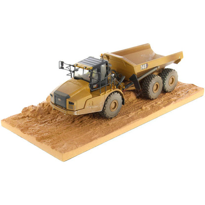 Model of Weathered Caterpillar 745 Articulated Dump Truck Mounted on a Simulated Dirt Road Base on a White Background