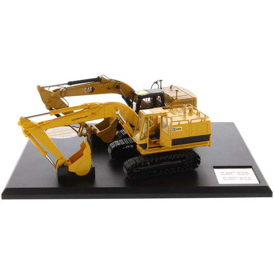 Two Caterpillar Excavator Models on a Black Base and White Background