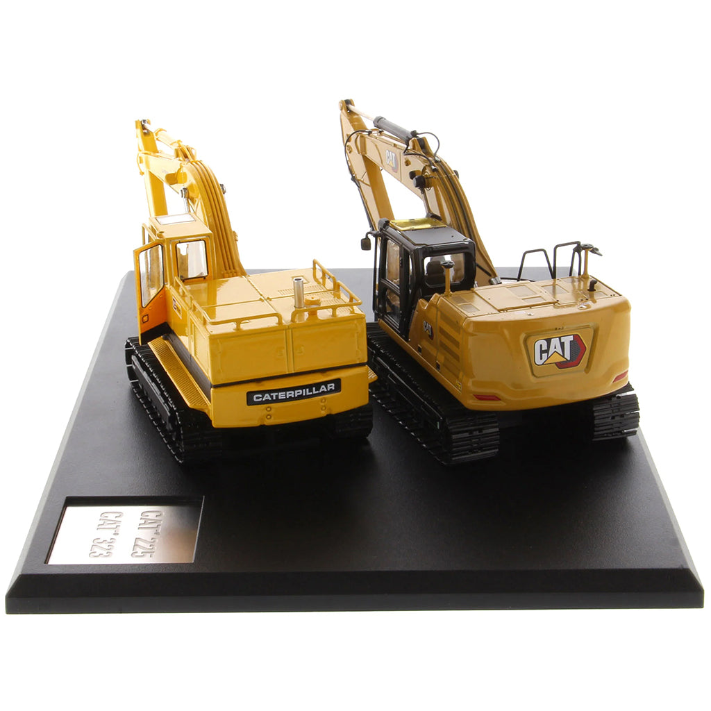 Two Caterpillar Excavator Models on a Black Base and White Background