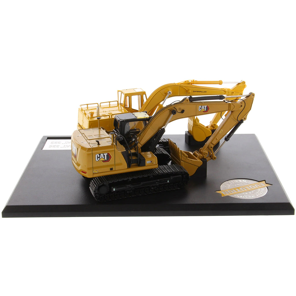 Two Caterpillar Excavator Models on a Black Base and White Background