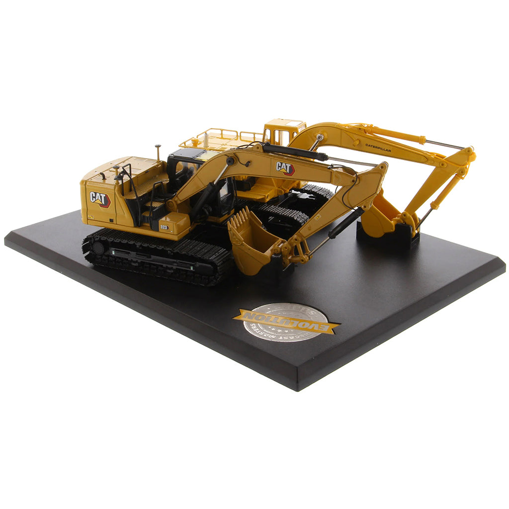 Two Caterpillar Excavator Models on a Black Base and White Background