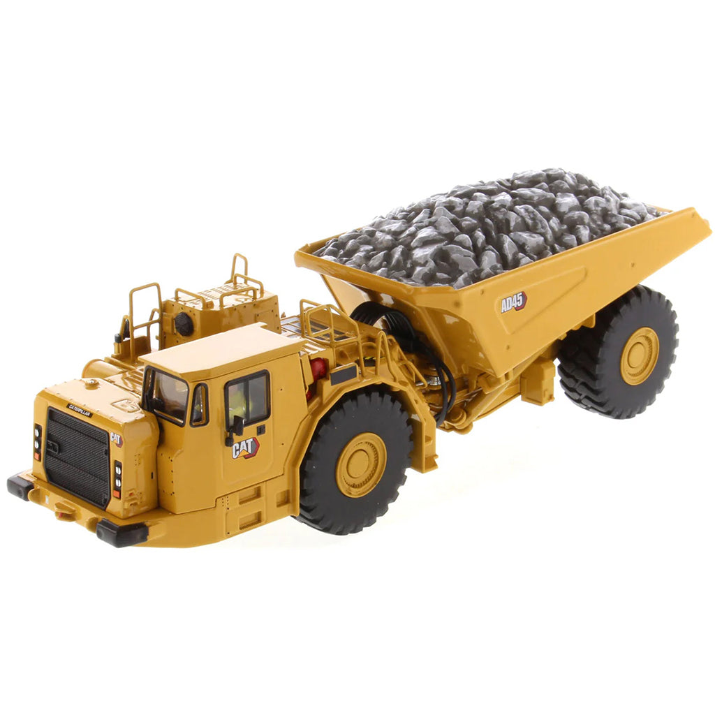 Model of a Caterpillar AD45 Underground Articulated Dump Truck with a Load of Coal on a White Background