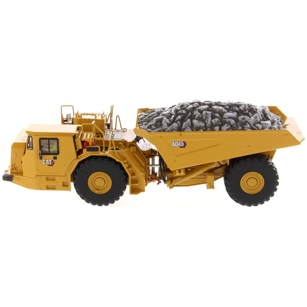 Model of a Caterpillar AD45 Underground Articulated Dump Truck with a Load of Coal on a White Background