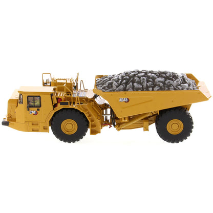 Model of a Caterpillar AD45 Underground Articulated Dump Truck with a Load of Coal on a White Background