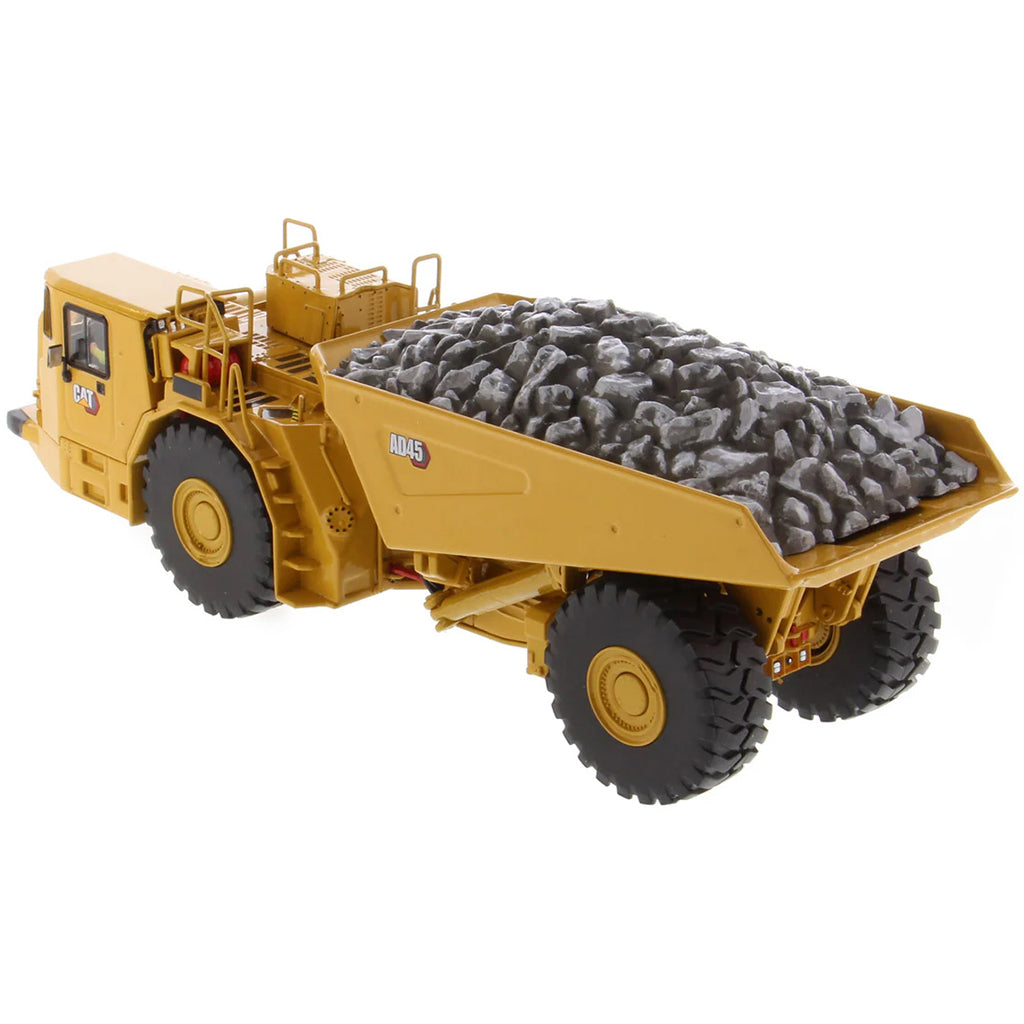 Model of a Caterpillar AD45 Underground Articulated Dump Truck with a Load of Coal on a White Background