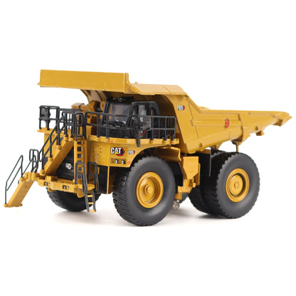 1/87th Scale Diecast Model of a CAT Yellow and Black Caterpillar 785 Mining Dump Truck Photographed on a White Background