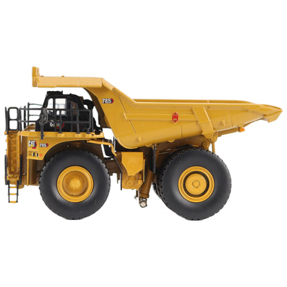 1/87th Scale Diecast Model of a CAT Yellow and Black Caterpillar 785 Mining Dump Truck Photographed on a White Background