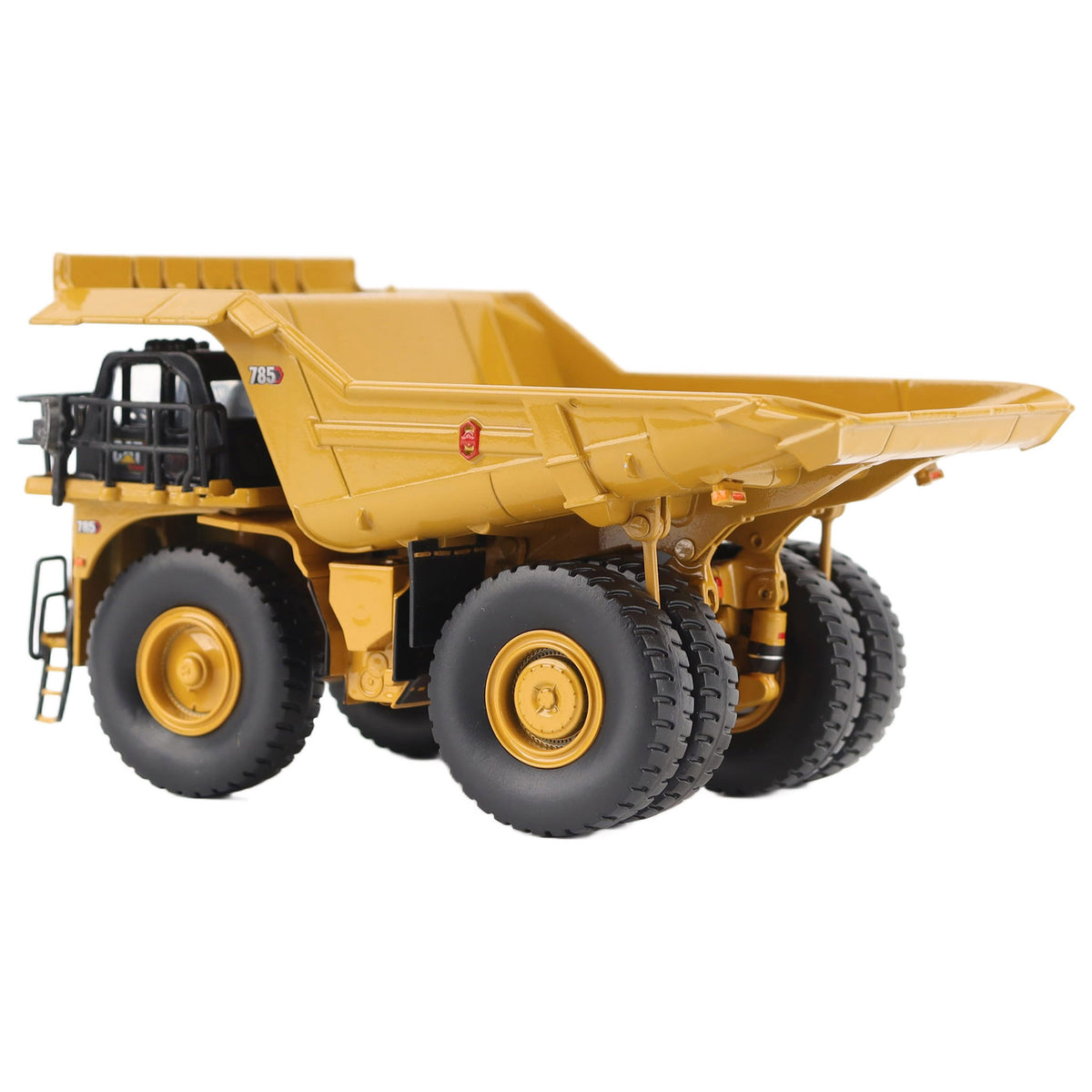 1/87th Scale Diecast Model of a CAT Yellow and Black Caterpillar 785 Mining Dump Truck Photographed on a White Background