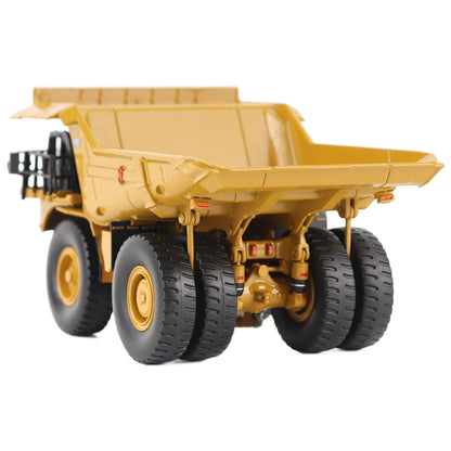 1/87th Scale Diecast Model of a CAT Yellow and Black Caterpillar 785 Mining Dump Truck Photographed on a White Background