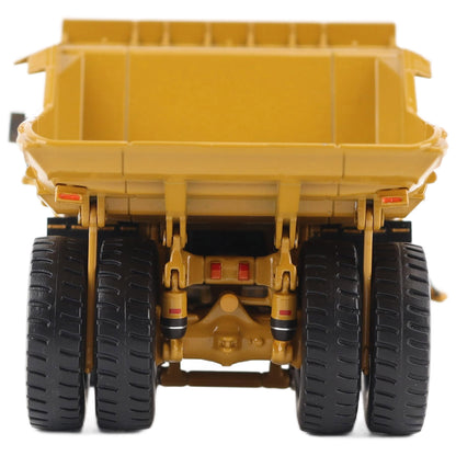 1/87th Scale Diecast Model of a CAT Yellow and Black Caterpillar 785 Mining Dump Truck Photographed on a White Background