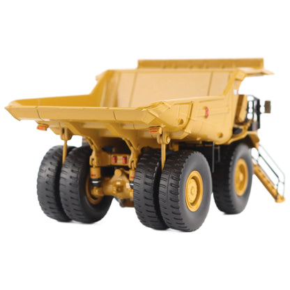 1/87th Scale Diecast Model of a CAT Yellow and Black Caterpillar 785 Mining Dump Truck Photographed on a White Background