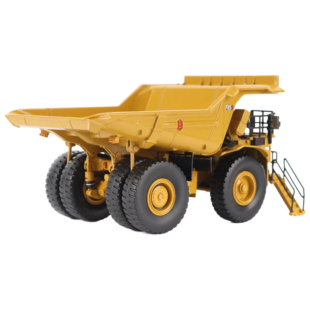 1/87th Scale Diecast Model of a CAT Yellow and Black Caterpillar 785 Mining Dump Truck Photographed on a White Background