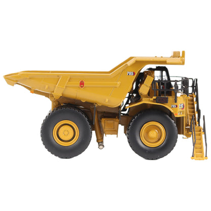 1/87th Scale Diecast Model of a CAT Yellow and Black Caterpillar 785 Mining Dump Truck Photographed on a White Background