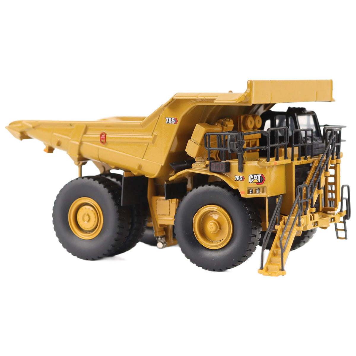 1/87th Scale Diecast Model of a CAT Yellow and Black Caterpillar 785 Mining Dump Truck Photographed on a White Background