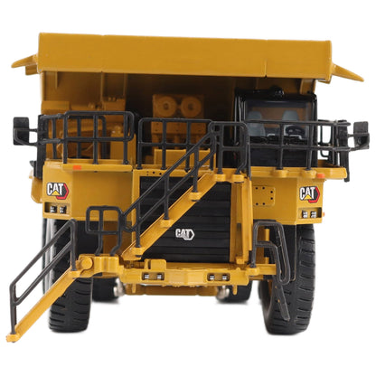 1/87th Scale Diecast Model of a CAT Yellow and Black Caterpillar 785 Mining Dump Truck Photographed on a White Background