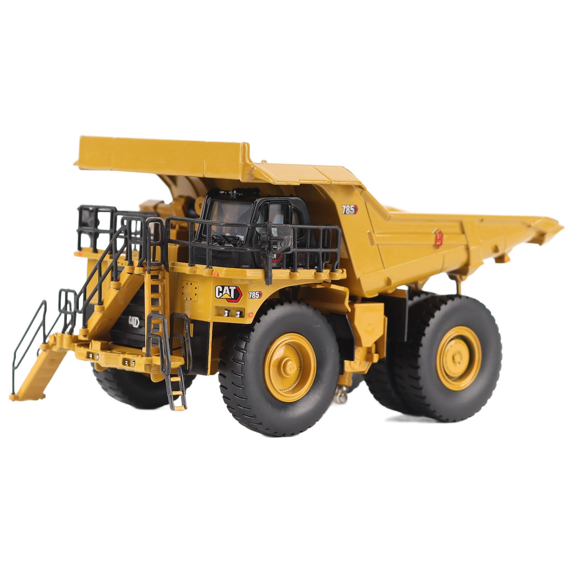 1/87th Scale Diecast Model of a CAT Yellow and Black Caterpillar 785 Mining Dump Truck Photographed on a White Background