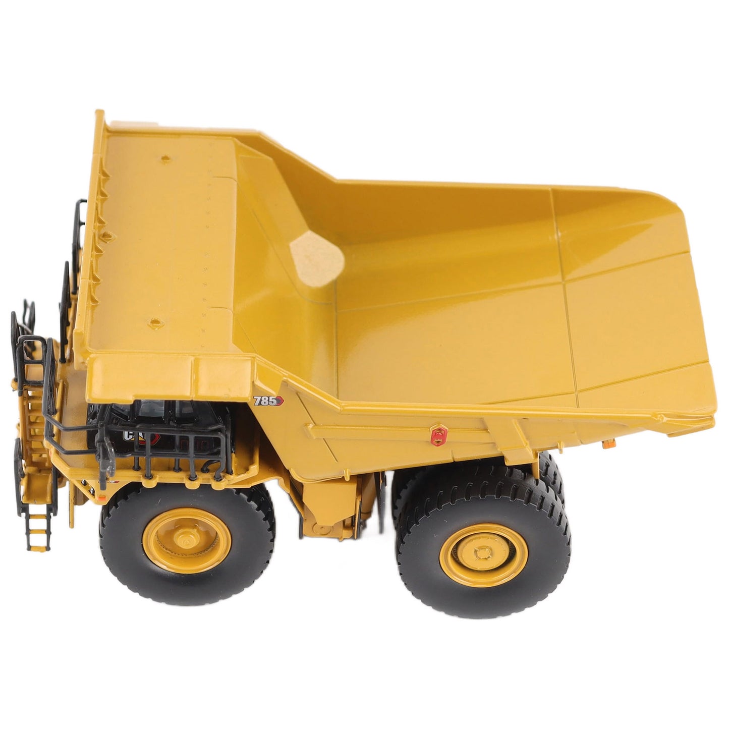 1/87th Scale Diecast Model of a CAT Yellow and Black Caterpillar 785 Mining Dump Truck Photographed on a White Background
