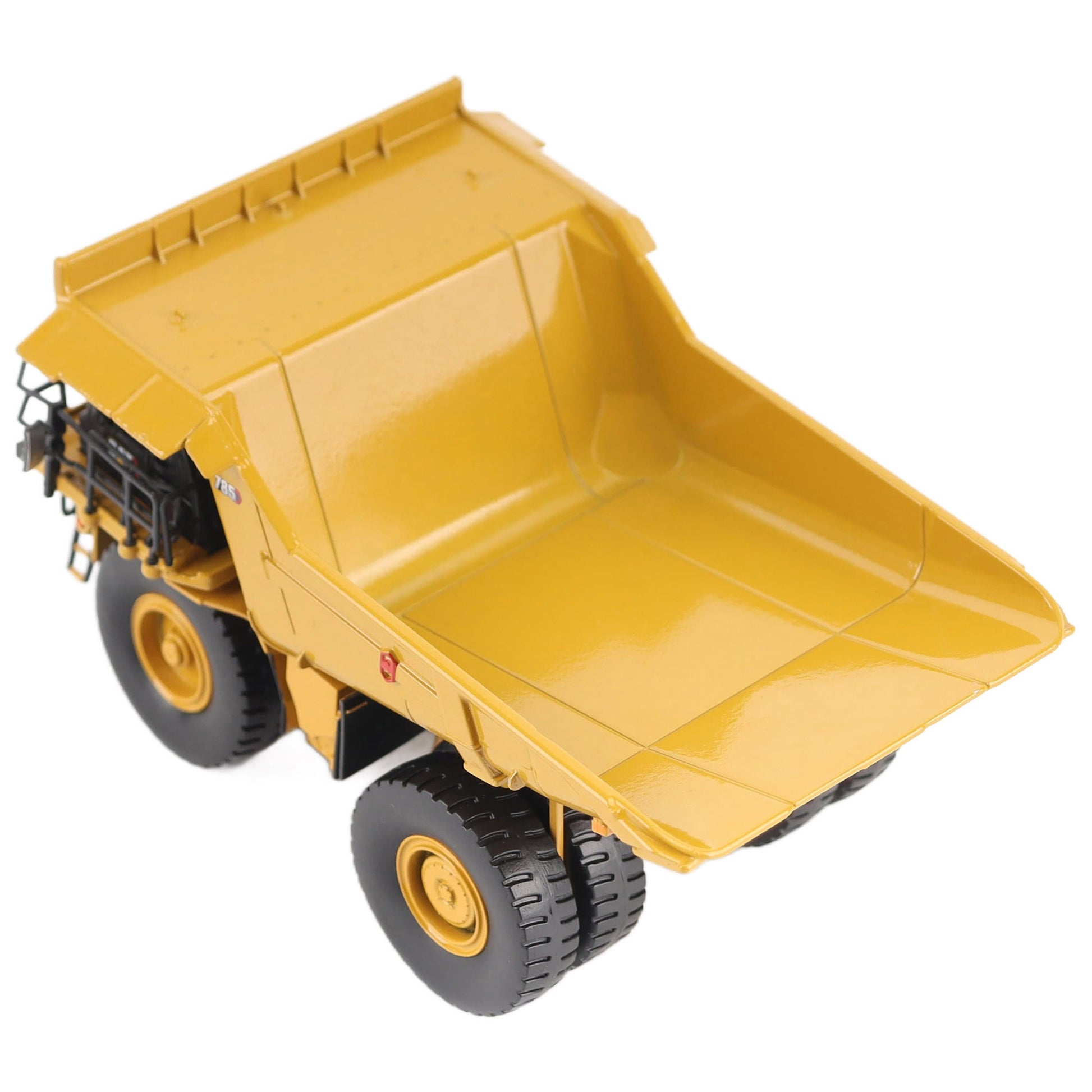 1/87th Scale Diecast Model of a CAT Yellow and Black Caterpillar 785 Mining Dump Truck Photographed on a White Background