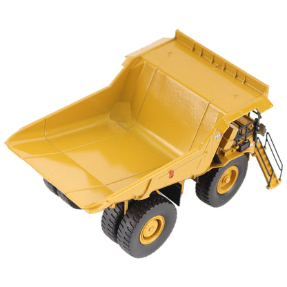 1/87th Scale Diecast Model of a CAT Yellow and Black Caterpillar 785 Mining Dump Truck Photographed on a White Background