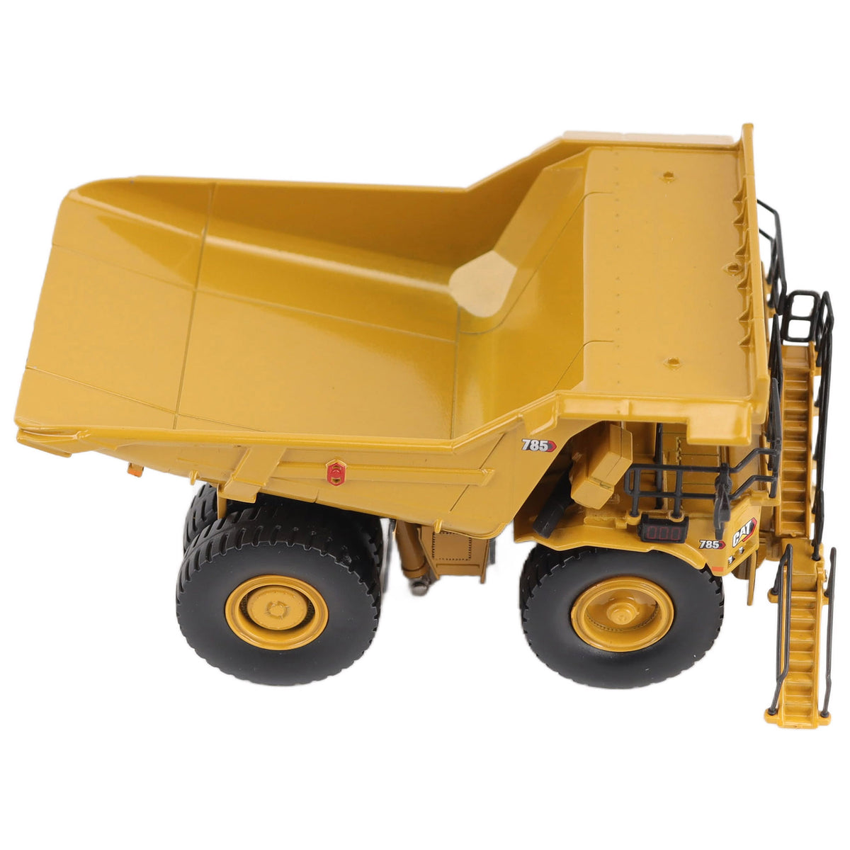 1/87th Scale Diecast Model of a CAT Yellow and Black Caterpillar 785 Mining Dump Truck Photographed on a White Background