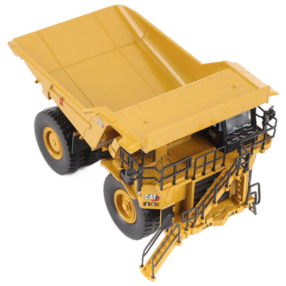 1/87th Scale Diecast Model of a CAT Yellow and Black Caterpillar 785 Mining Dump Truck Photographed on a White Background