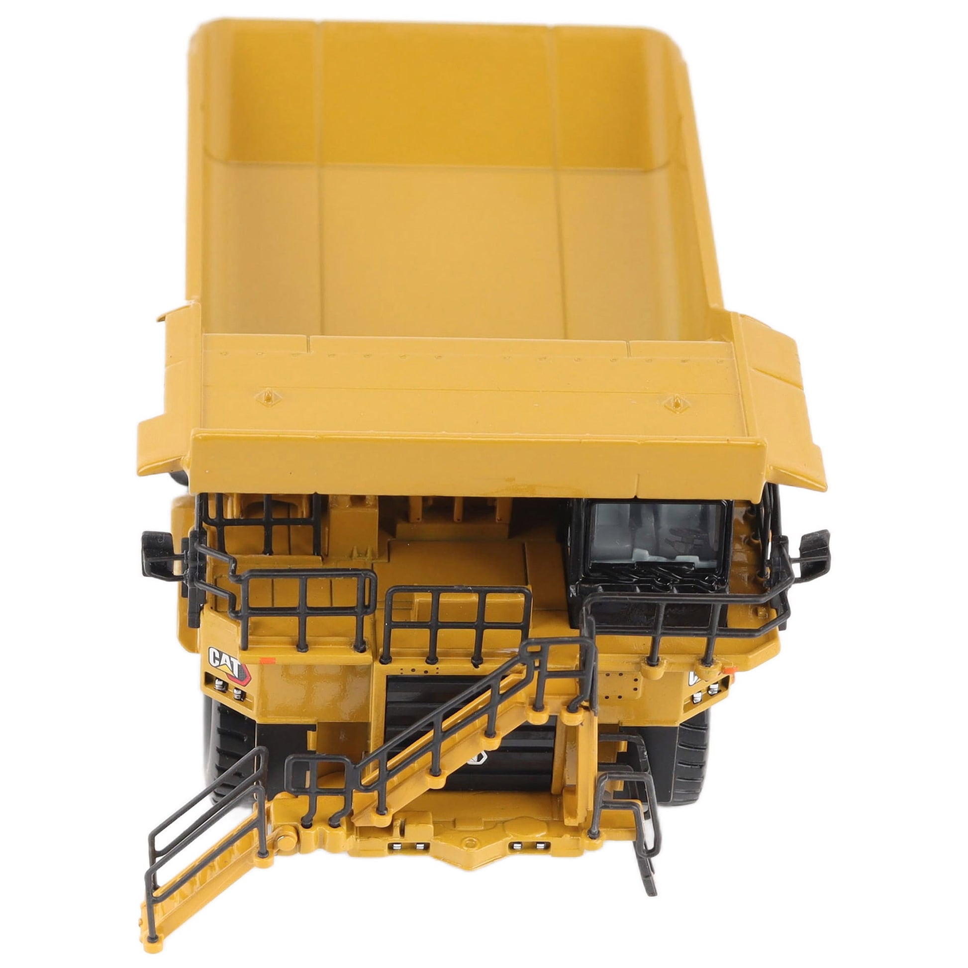 1/87th Scale Diecast Model of a CAT Yellow and Black Caterpillar 785 Mining Dump Truck Photographed on a White Background