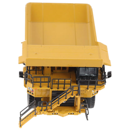 1/87th Scale Diecast Model of a CAT Yellow and Black Caterpillar 785 Mining Dump Truck Photographed on a White Background