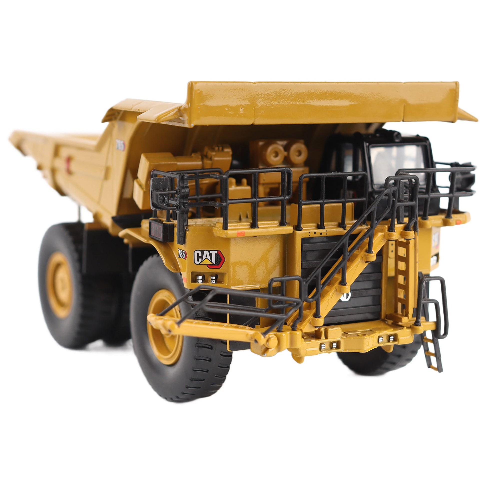 1/87th Scale Diecast Model of a CAT Yellow and Black Caterpillar 785 Mining Dump Truck Photographed on a White Background