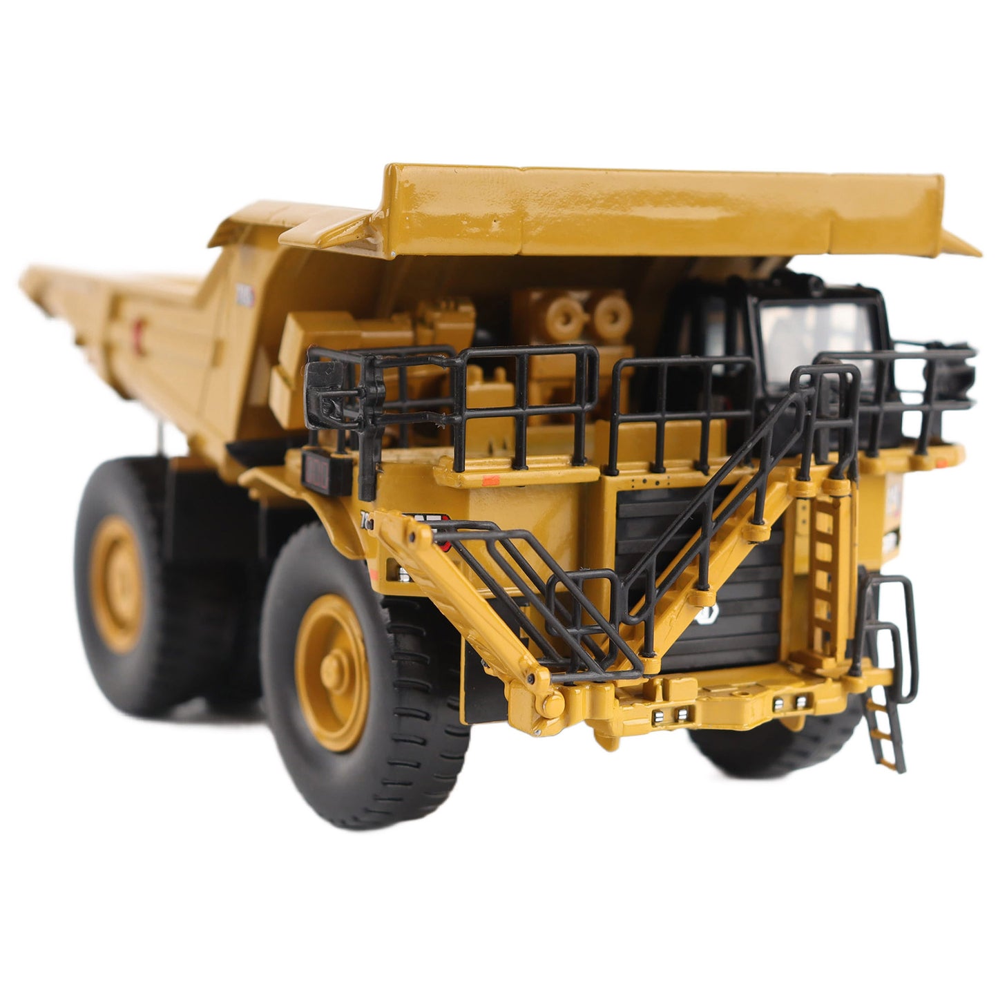 1/87th Scale Diecast Model of a CAT Yellow and Black Caterpillar 785 Mining Dump Truck Photographed on a White Background