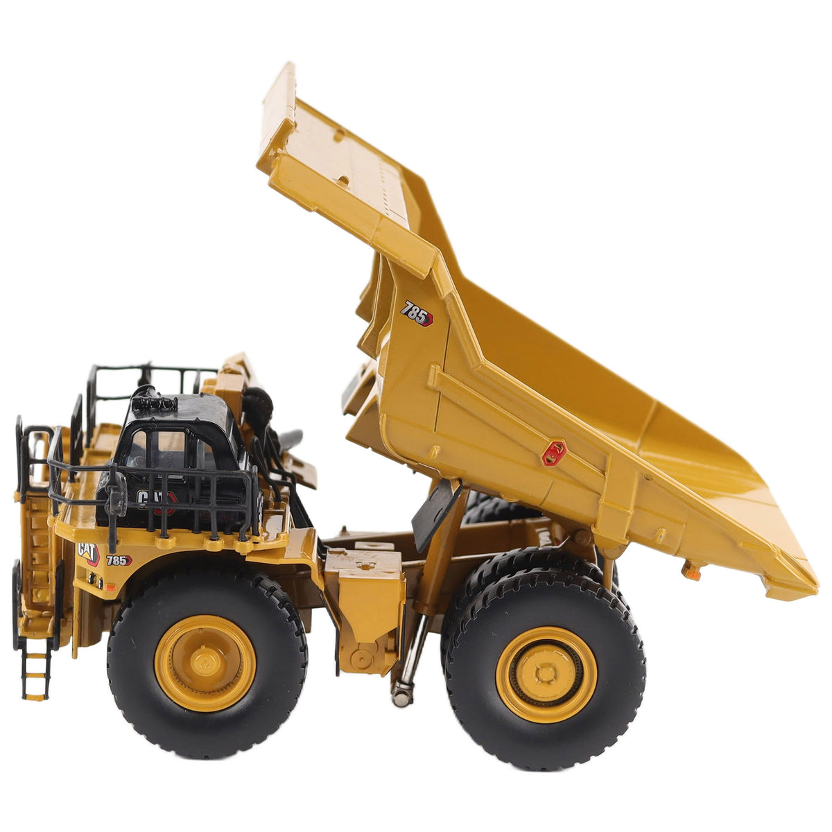 1/87th Scale Diecast Model of a CAT Yellow and Black Caterpillar 785 Mining Dump Truck Photographed on a White Background