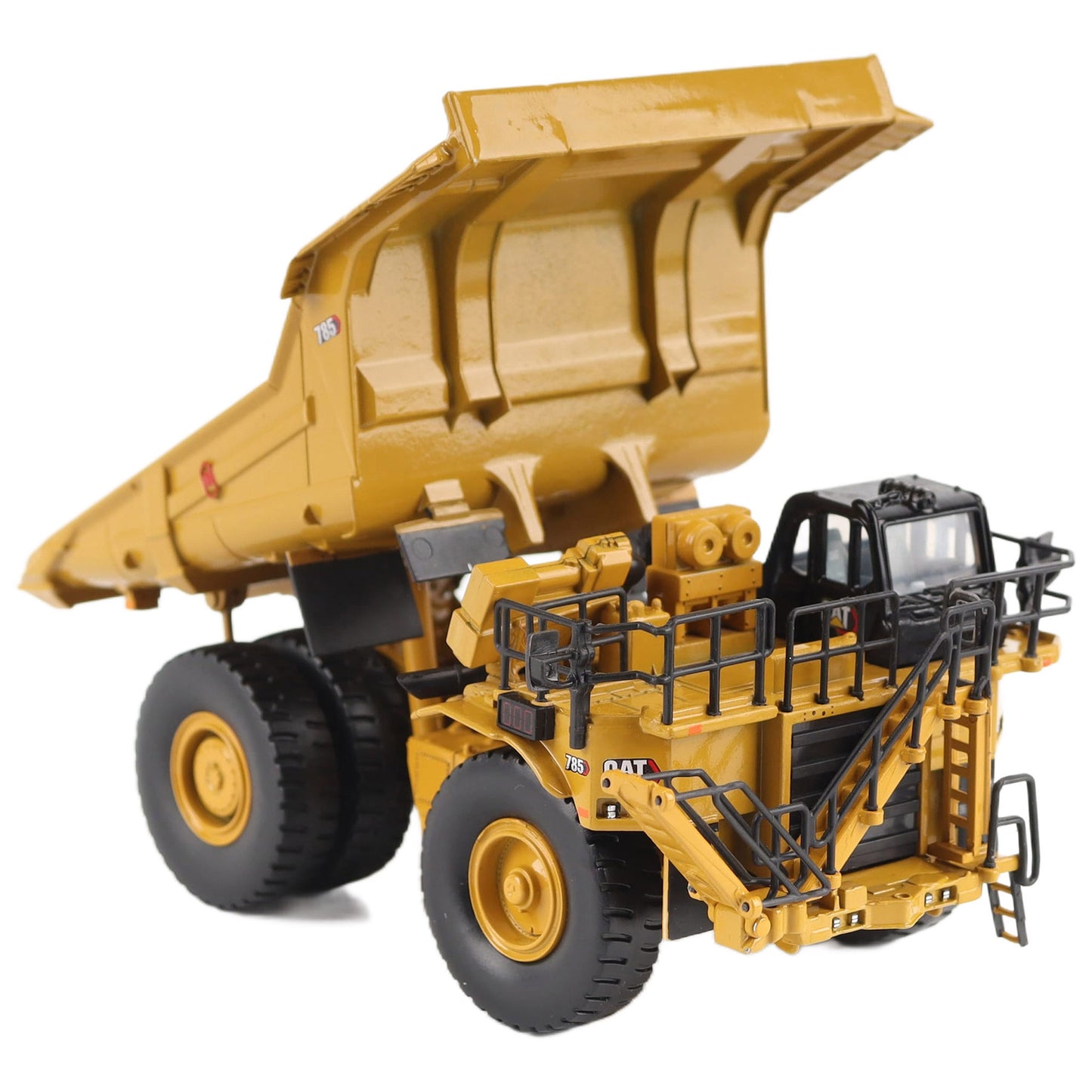 1/87th Scale Diecast Model of a CAT Yellow and Black Caterpillar 785 Mining Dump Truck Photographed on a White Background