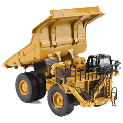 1/87th Scale Diecast Model of a CAT Yellow and Black Caterpillar 785 Mining Dump Truck Photographed on a White Background