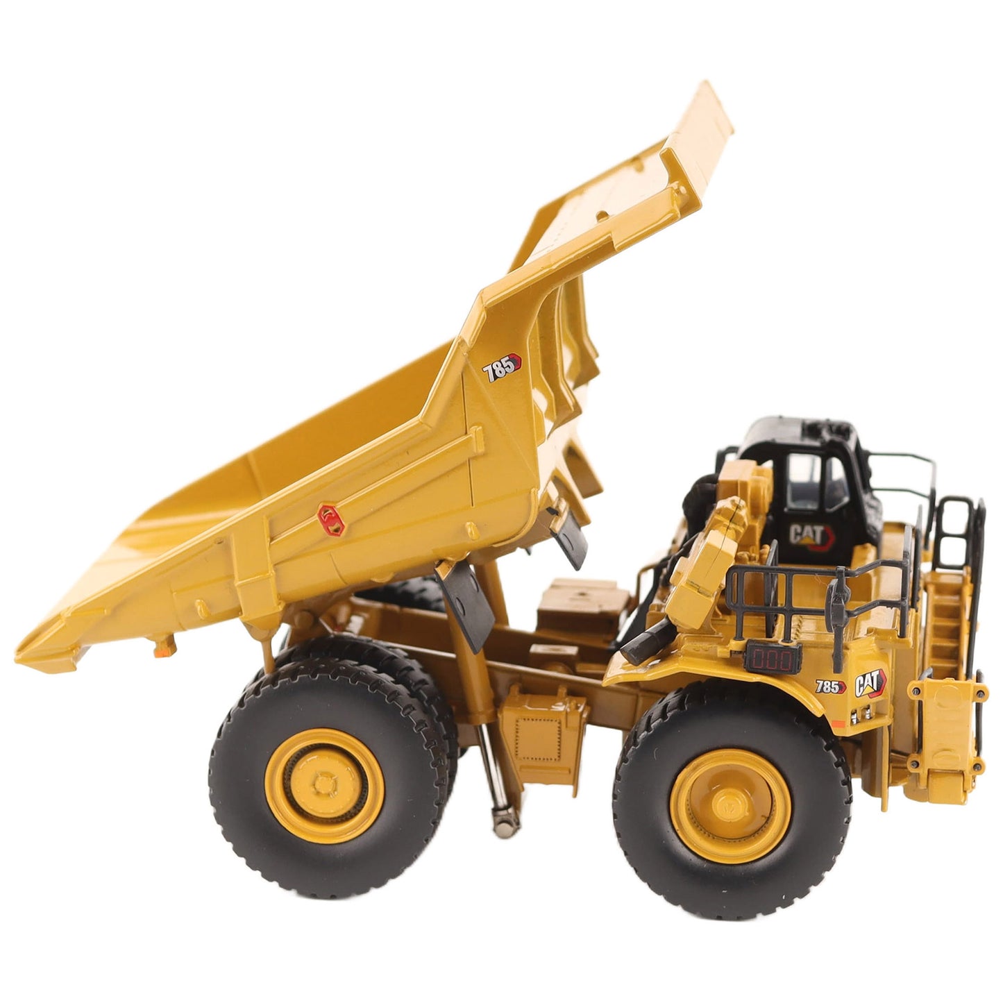 1/87th Scale Diecast Model of a CAT Yellow and Black Caterpillar 785 Mining Dump Truck Photographed on a White Background