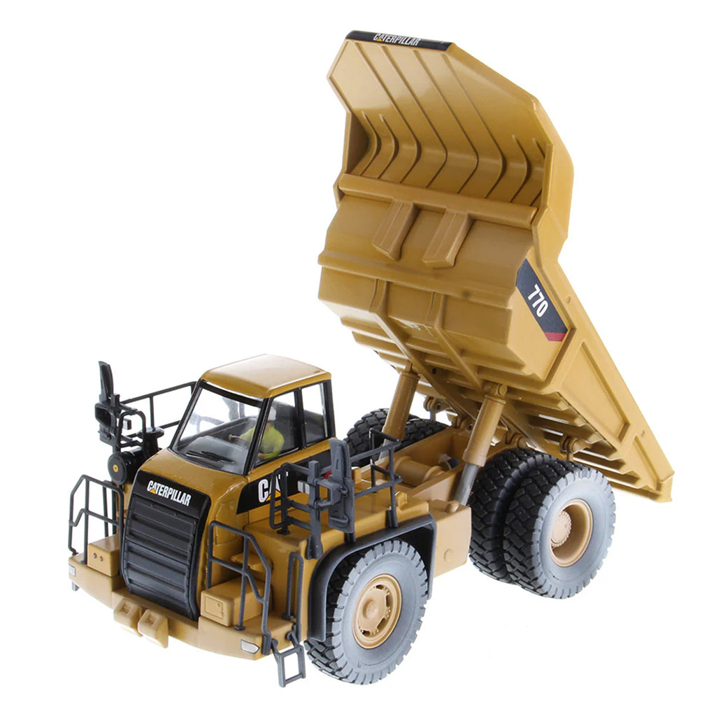 Model of a Weathered Caterpillar 770 Off-Highway Dump Truck on a White Background