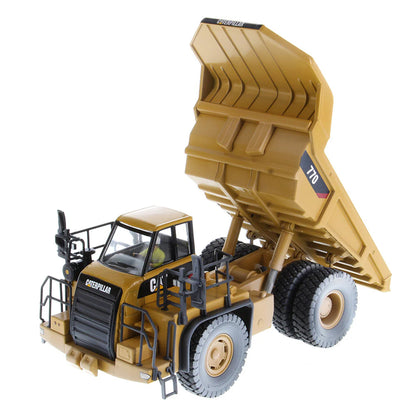 Model of a Weathered Caterpillar 770 Off-Highway Dump Truck on a White Background