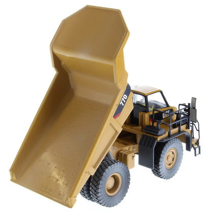 Model of a Weathered Caterpillar 770 Off-Highway Dump Truck on a White Background