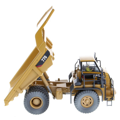 Model of a Weathered Caterpillar 770 Off-Highway Dump Truck on a White Background