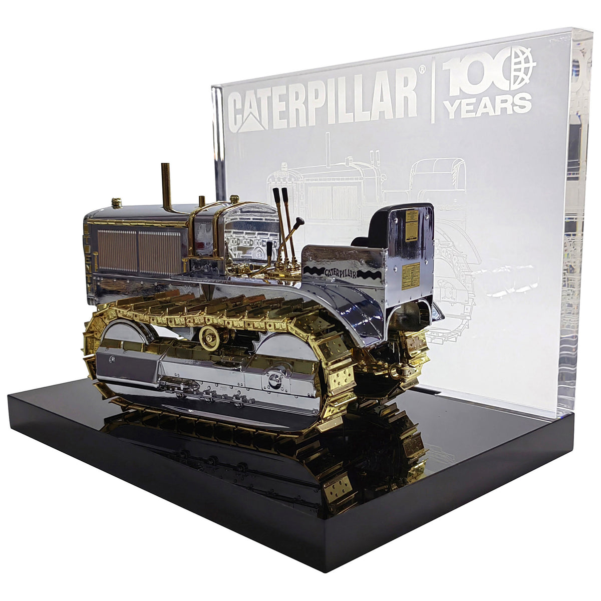 1:16th Scale Diecast Model of a Caterpillar Twenty Crawler Tractor that is Chrome Plated with Gold Plated Accents Photographed on a White Background