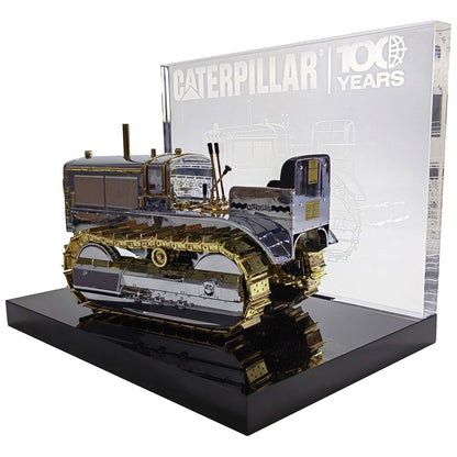 1:16th Scale Diecast Model of a Caterpillar Twenty Crawler Tractor that is Chrome Plated with Gold Plated Accents Photographed on a White Background