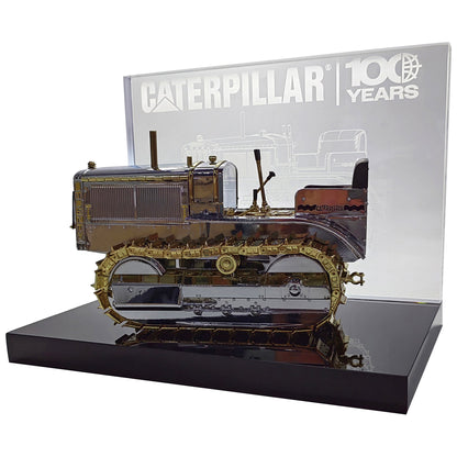 1:16th Scale Diecast Model of a Caterpillar Twenty Crawler Tractor that is Chrome Plated with Gold Plated Accents Photographed on a White Background