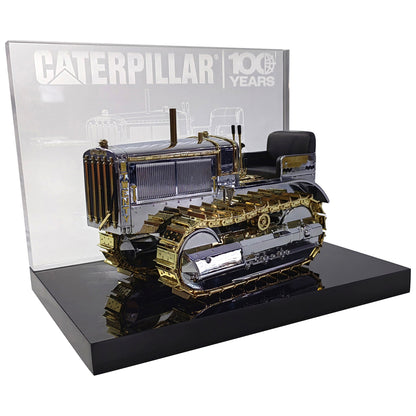 1:16th Scale Diecast Model of a Caterpillar Twenty Crawler Tractor that is Chrome Plated with Gold Plated Accents Photographed on a White Background