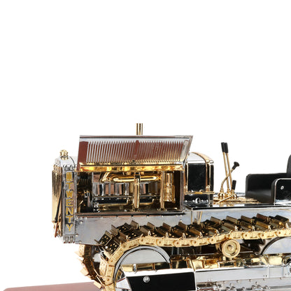 1:16th Scale Diecast Model of a Caterpillar Twenty Crawler Tractor that is Chrome Plated with Gold Plated Accents Photographed on a White Background