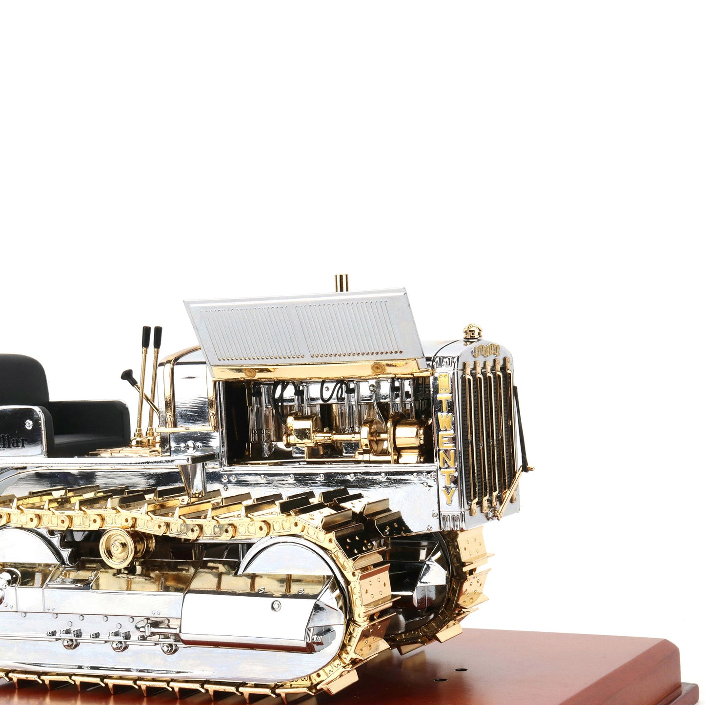 1:16th Scale Diecast Model of a Caterpillar Twenty Crawler Tractor that is Chrome Plated with Gold Plated Accents Photographed on a White Background