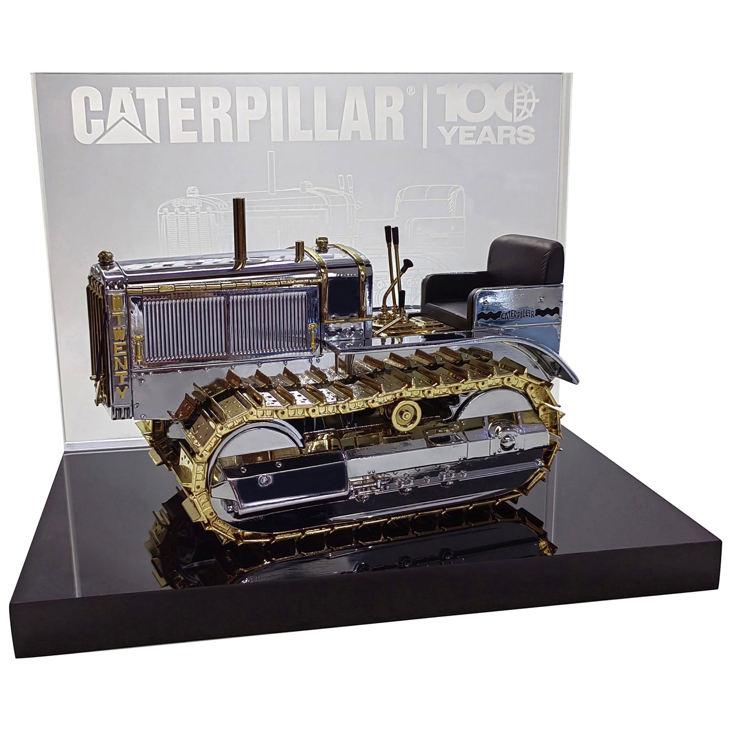 1:16th Scale Diecast Model of a Caterpillar Twenty Crawler Tractor that is Chrome Plated with Gold Plated Accents Photographed on a White Background