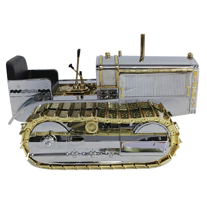 1:16th Scale Diecast Model of a Caterpillar Twenty Crawler Tractor that is Chrome Plated with Gold Plated Accents Photographed on a White Background