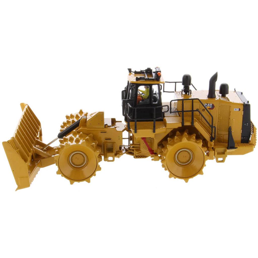 Model of a Caterpillar 836 Landfill Compactor on a White Background