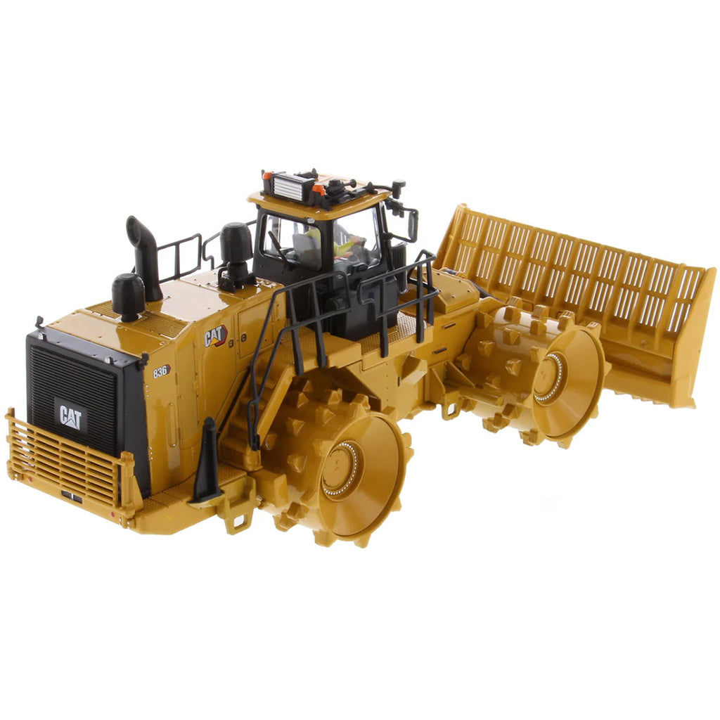 Model of a Caterpillar 836 Landfill Compactor on a White Background